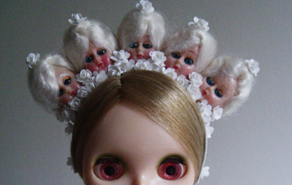 This piece is in all white, with 1940s doll heads and flowers.